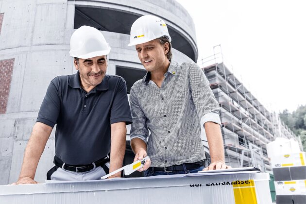 Working-in-partnership-sales-representative-and-tradesman-on-the-construction-site_W2400xH0